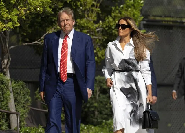 Former U.S. President Donald Trump and former first lady Melania Trump walk together as they prepare to vote at a polling station setup in the Morton and Barbara Mandel Recreation Center on March 19, 2024, in Palm Beach, Florida. Trump, along with other registered Republican voters, cast ballots in the Presidential Preference Primary. There wasn't a ballot or election for Democrats since the Florida Democratic Party only provided the name of Joseph R. Biden Jr. (Photo by Joe Raedle/Getty Images)