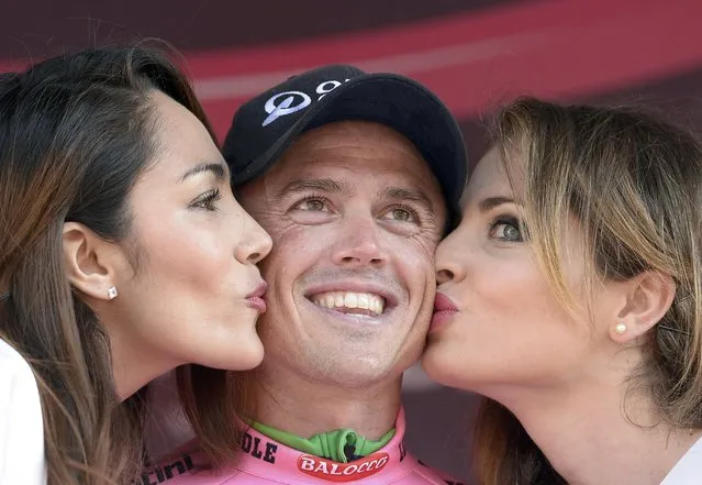Orica Greenedge rider Simon Gerrands of Australia receives kisses after winning in the 17.6 km (11 miles)  team time-trial first stage of the 98th Giro d'Italia (Tour of Italy) cycling race from San Lorenzo a Mare to Sanremo, Italy, May 9, 2015. (Photo by Fabio Ferrari/Reuters/LaPresse)