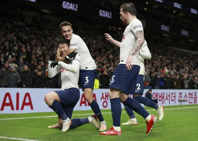 Tottenham's Son Heung-min, left, celebrates after scoring his side's second goal during the English Premier League soccer match between Tottenham Hotspur and Brentford at Tottenham Hotspur Stadium in London, England, Thursday, December 2, 2021. (Photo by Ian Walton/AP Photo)