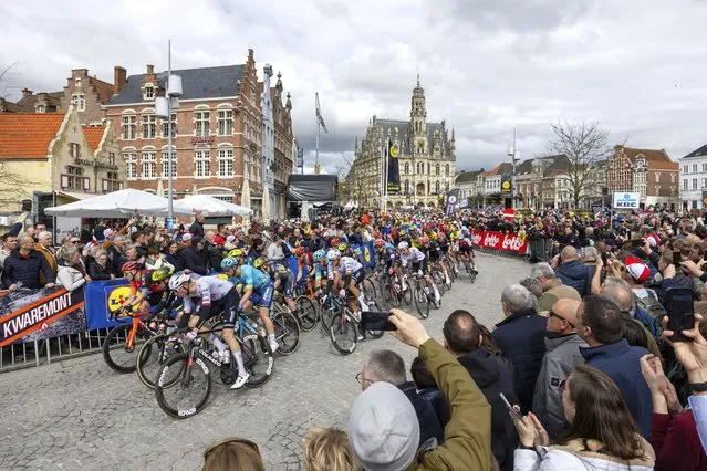 Norway's Vegard Stake Laengen of the UAE Team Emirates, third left, rides with the pack through the historical center of Oudenaarde, Belgium, during the Tour of Flanders on Sunday, March 31, 2024. (Photo by Geert Vanden Wijngaert/AP Photo)