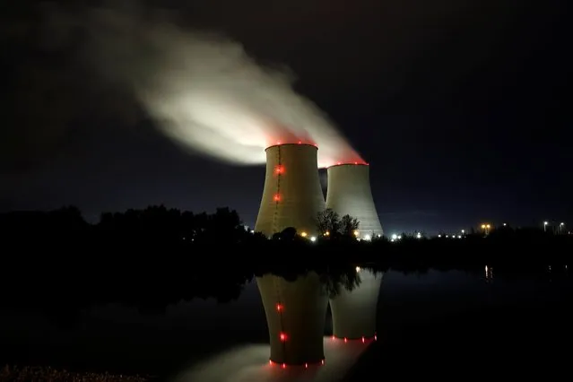 Steam rises from cooling towers of the Electricite de France (EDF) nuclear power plant in Belleville-sur-Loire, France on October 12, 2021. (Photo by Benoit Tessier/Reuters)