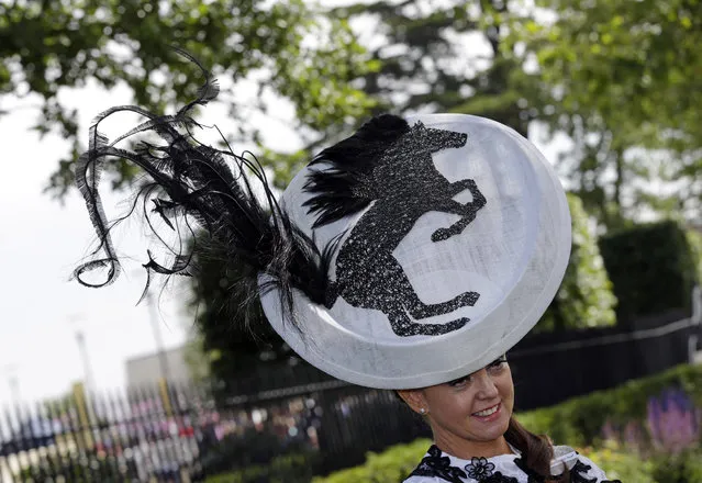 Gail Hayden-Stapf poses for photographers as she arrives for the first day of  Royal Ascot horse racing meet at Ascot, England, Tuesday, June 16, 2015. Royal Ascot is the annual five day horse race meeting that Britain's Queen Elizabeth II attends every day of the event. (AP Photo/Alastair Grant)