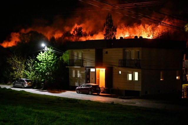 Fires engulf the woods near Kosovo’s capital of Pristina, Kosovo on April 13, 2024. (Photo by Armend Nimani/AFP Photo)