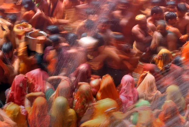 Hindu devotees take part in “Huranga”, a game played between men and women a day after Holi, at Dauji temple near Mathura, March 14, 2017. (Photo by Cathal McNaughton/Reuters)