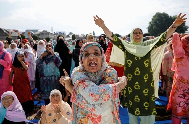 Kashmiri women shout pro-freedom slogans before offering the Eid-al-Adha prayers at a mosque during restrictions after the scrapping of the special constitutional status for Kashmir by the Indian government, in Srinagar, August 12, 2019. (Photo by Danish Siddiqui/Reuters)