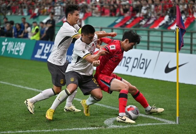South Korea's Hong Hyun-seok (R) fights for the ball with China's Wu Lei (L) and Fang Hao (C) during the FIFA World Cup 2026 Asia zone qualifiers football match between South Korea and China in Seoul on June 11, 2024. (Photo by Jung Yeon-je/AFP Photo)