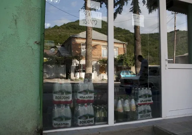 Bottles of Borjomi bottled mineral water (R, L) are seen at a shop in Leningori (or Akhalgori), in the breakaway region of South Ossetia, Georgia, July 6, 2015. (Photo by Kazbek Basaev/Reuters)