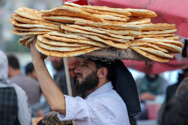 A vendor sells bread on a roadside in Kabul, Afghanistan, 03 June 2024. An estimated 14.2 million people in Afghanistan, which accounts for 37% of the population, currently face acute food insecurity, the UN's Food and Agriculture Organization (FAO) said. Richard Trenchard, the FAO country representative, informed that the organization's latest Integrated Food Security Phase Classification (IPC) report for March-April 2024 indicates a 'continuing positive trend.' However, Afghanistan still ranks among the world's worst food insecurity crises, with over 2 million people in emergency levels. (Photo by Samiullah Popal/EPA/EFE)