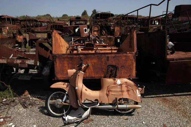 A motorcycle owned by Turkish Cypriots that was abandoned during a war more than 40 years ago is seen at Episkopi British military base, Cyprus May 25, 2016. (Photo by Yiannis Kourtoglou/Reuters)