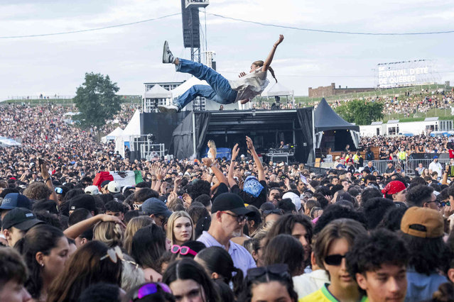 Festivalgoers are seen during Festival d'ete de Quebec on Saturday, July 13, 2024, in Quebec City. (Photo by Amy Harris/Invision/AP Photo)