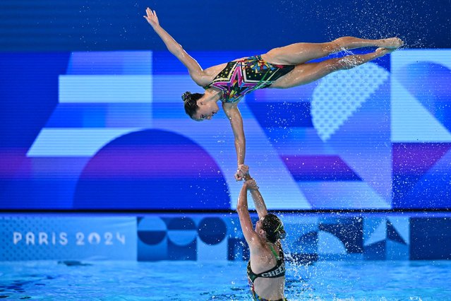 Team Australia compete in the team acrobatic routine of the artistic swimming event during the Paris 2024 Olympic Games at the Aquatics Centre in Saint-Denis, north of Paris, on August 7, 2024. (Photo by Manan Vatsyayana/AFP Photo)