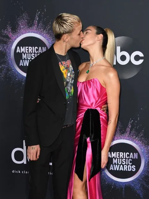 British singer Dua Lipa and US model Anwar Hadid arrive for the 2019 American Music Awards at the Microsoft theatre on November 24, 2019 in Los Angeles. (Photo by Mark Ralston/AFP Photo)