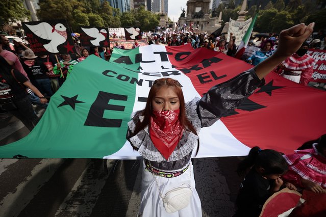 Protestors attend the “Stop the War against the Zapatista Peoples” march in Mexico City, Mexico on June 8, 2023. Several thousand people marched in Mexico City, in San Cristobal de las Casas (Chiapas) and some other places in the country to demand an end to the recent attacks carried out by paramilitary groups against the Zapatista communities in the southern state. (Photo by Jose Mendez/EPA/EFE)