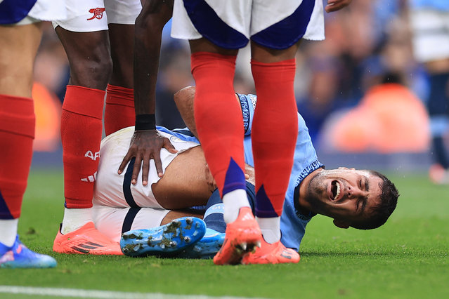 Rodri of Manchester City lies injured during the Premier League match between Manchester City FC and Arsenal FC at Etihad Stadium on September 22, 2024 in Manchester, England. (Photo by Simon Stacpoole/Offside/Offside via Getty Images)