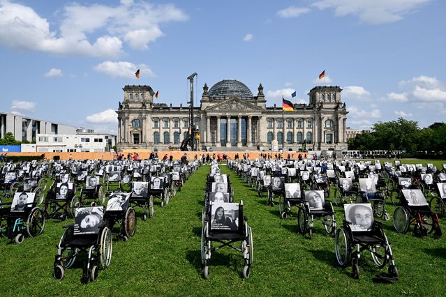 Hundreds of wheelchairs symbolizing the fates of long-Covid patients placed by the initiative 'Not recovered' are parked in front of the German parliament Bundestag in Berlin, Germany, 04 July 2023. (Photo by Filip Singer/EPA)