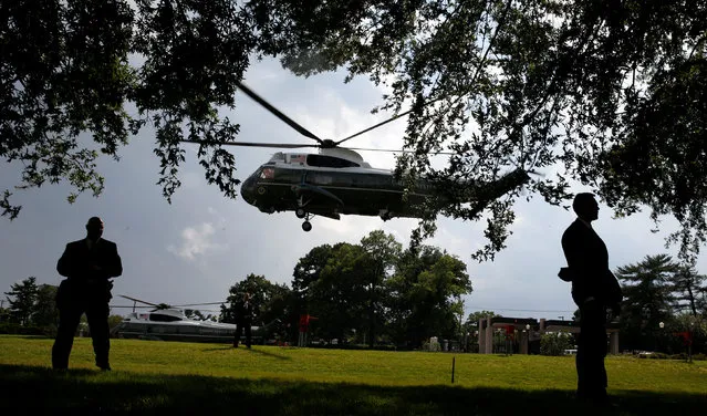 Agents stand guard as U.S. President Barack Obama departs Walter Reed National Military Medical Center aboard Marine One in Bethesda, Maryland June 21, 2016. (Photo by Kevin Lamarque/Reuters)