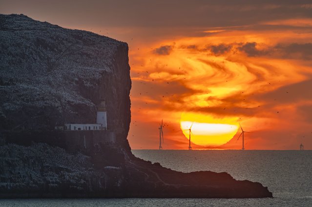 The sun rises behind the island of Bass Rock in the Firth of Forth, United Kingdom on July 31, 2024. (Photo by Euan Cherry/The Times)