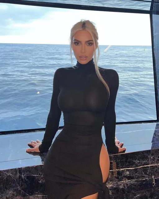 American socialite Kim Kardashian, 41, has gone commando for a new photoshoot on an expensive yacht. The reality star took to her Instagram profile on Thursday, June 30, 2022 to post a series of pictures in a skintight long-sleeved black turtleneck dress with a cutout detail along the left hip. (Photo by Kim Kardashian/Instagram)