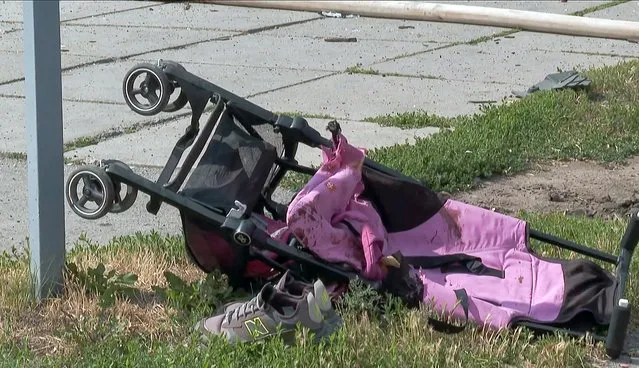 A video grab taken from AFPTV footage on July 14, 2022 and released on July 15, 2022 shows a stroller lying on the ground after Russian missiles have struck Vinnytsia, in central Ukraine, killing at least 20 people including three children, in what President Volodymyr Zelensky called “an open act of terrorism”. (Photo by Sergii Volskyi/AFP Photo)