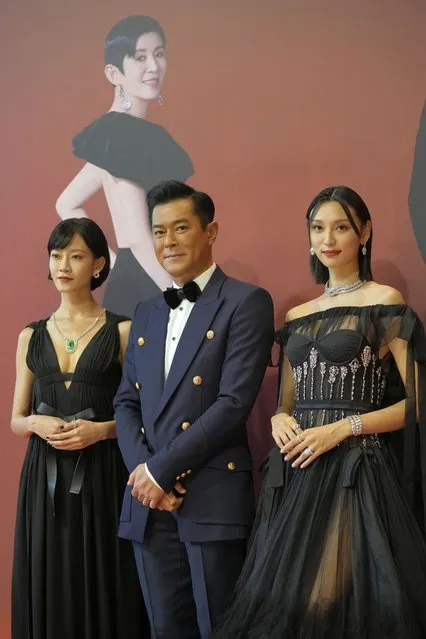 From Left, Hong Kong actress Fish Liew, actor Louis Koo and actress Louise Wong pose on red carpet at the Hong Kong Film Awards, Sunday, July 17, 2022. (Photo by Kin Cheung/AP Photo)
