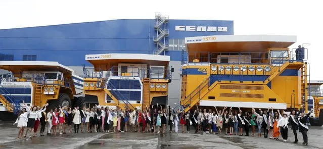 Participants in the “Mrs Universe 2015” contest pose for a photo at the Belarusian Autoworks (BELAZ) plant during their visit in Zhodino, Belarus, August 26, 2015. (Photo by Vasily Fedosenko/Reuters)