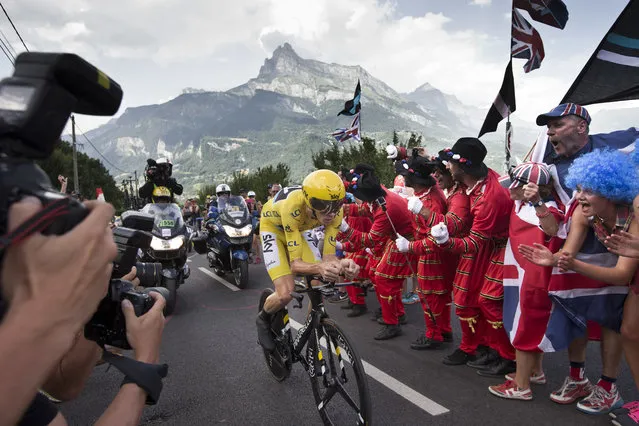 Britain's Chris Froome, wearing the overall leader's yellow jersey, climbs during the eighteenth stage of the Tour de France cycling race, an individual time trial over 17 kilometers (10.6 miles) with start in Sallanches and finish in Megeve, France, Thursday, July 21, 2016. (Photo by Peter Dejong/AP Photo)