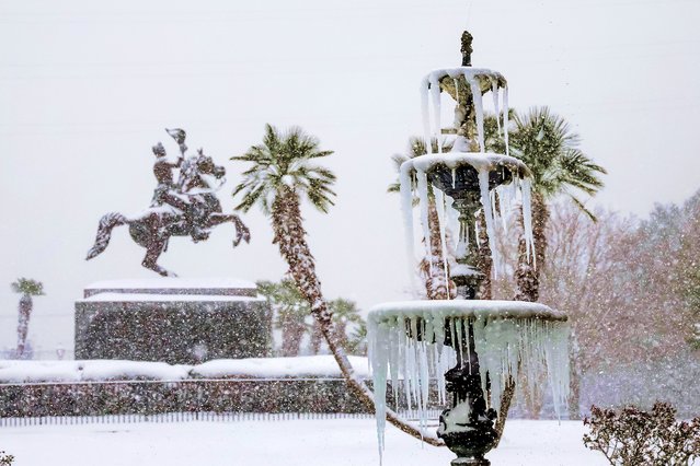A frozen fountain and the snow-covered Andrew Jackson statue in the French Quarter during a rare winter storm in New Orleans, Louisiana, USA, 21 January 2025. A winter storm is affecting most of the Gulf Coast of the southern United States. The storm has hampered travel and closed schools and businesses in the area. (Photo by Derick Hingle/EPA/EFE)