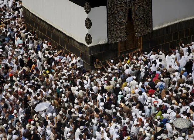 Muslim pilgrims pray around the holy Kaaba at the Grand Mosque ahead of the annual haj pilgrimage in Mecca September 21, 2015. (Photo by Ahmad Masood/Reuters)