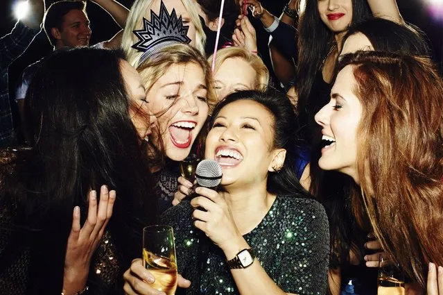 Group of friends having fun on night out. Karaoke. (Photo by Flashpop/Getty Images)
