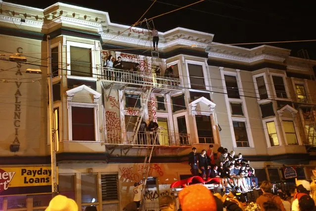 Revellers celebrate in the Mission District, in San Francisco, California October 29, 2014. (Photo by Stephen Lam/Reuters)