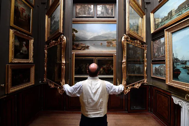 Visitor Assistant Jonty Stern poses in The Picture Room of The Sir John Soanes Museum on September 12, 2016 in London, England. The museum has recently undergone a seven year, £7million restoration with new areas opened to the public for the first time, allowing 10% more of the collection to now be displayed. (Photo by Leon Neal/Getty Images)