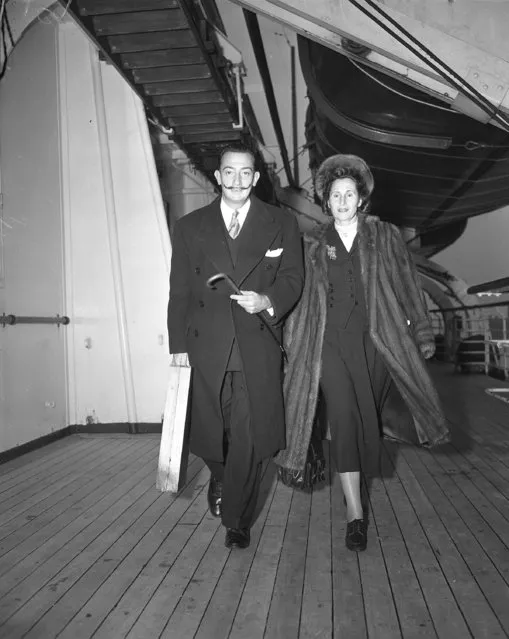 Salvador Dali is shown with his wife, Mrs. Gala Dali, as they arrive in New York on the S.S. America, December 21, 1949. (Photo by AP Photo/Rooney)