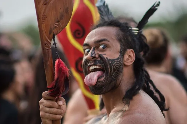 A Mauri indigenous man from New Zealand dances around a bonfire on the eve of the beginning of the first World Indigenous Games in Palmas, Tocantins, Brazil on October 22, 2015. (Photo by Christophe Simon/AFP Photo)