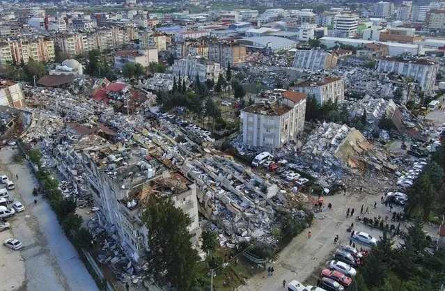 Aerial photo shows the destruction in Hatay city center, southern Turkey, Tuesday, February 7, 2023. Search teams and emergency aid from around the world poured into Turkey and Syria on Tuesday as rescuers working in freezing temperatures dug – sometimes with their bare hands – through the remains of buildings flattened by a magnitude 7.8 earthquake. The death toll soared above 5,000 and was still expected to rise. of collapsed buildings across the region. (Photo by IHA via AP Photo)