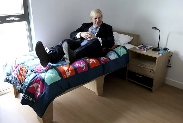 Mayor of London, Boris Johnson, tests out a bed during his visit to the 2012 Olympic Park and Olympic Village in London July 12, 2012. (Photo by Scott Heavey/Reuters)