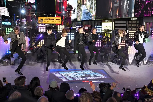 Korean pop band BTS performs at the Times Square New Year's Eve celebration in New York on December 31, 2019. Hybe, the South Korean entertainment company behind K-pop sensation BTS, said Wednesday, Feb. 22, 2023, it has completed its acquisition of a 14.8% stake in rival SM Entertainment, making it SM’s largest single shareholder. (Photo by Ben Hider/Invision/AP Photo)
