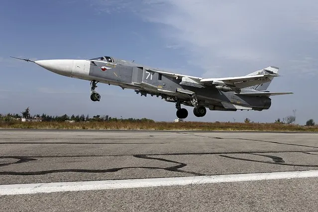 A Sukhoi Su-24 fighter jet takes off from the Hmeymim air base near Latakia, Syria, in this handout photograph released by Russia's Defence Ministry on October 22, 2015. (Photo by Reuters/Ministry of Defence of the Russian Federation)
