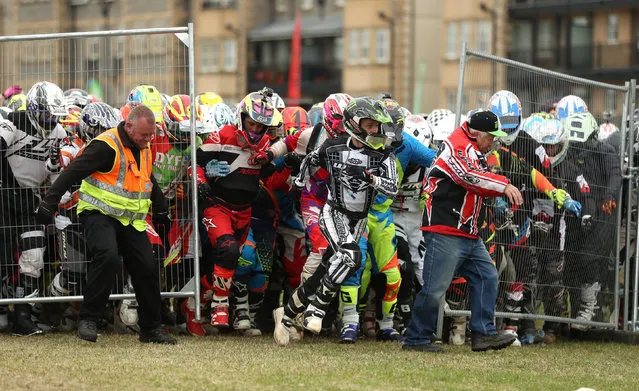 Riders race to their bikes at the start of the Quad and Sidecar Race in Weston- super- Mare, south west England, on October 8, 2016. (Photo by Andrew Matthews/PA Wire)