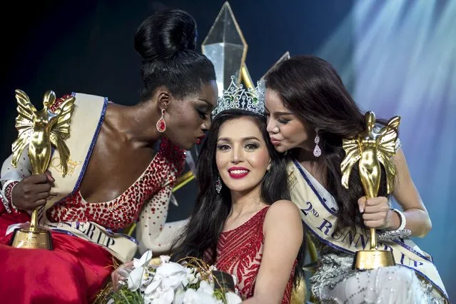 Contestant Trixie Maristela of Philippines is kissed by runner-ups as she was crowned winner of the Miss International Queen 2015 transgender/transsexual beauty pageant in Pattaya, Thailand, November 6, 2015. (Photo by Athit Perawongmetha/Reuters)