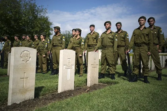 Israeli soldiers from the honour guard stand in the Commonwealth military cemetery during a memorial ceremony for the Commonwealth fallen in Ramle near Tel Aviv, Israel, November 8, 2015. (Photo by Amir Cohen/Reuters)