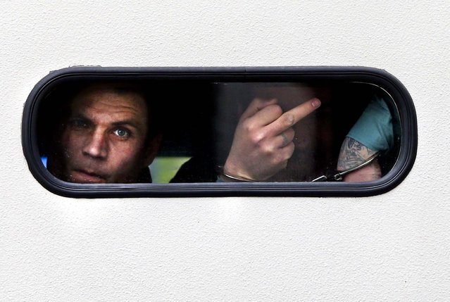 One of the four defendants in the NSU murder trial looks out from the window of a police van upon his arrival at the courthouse in Munich, Germany, on May 6, 2013. (Photo by Hassenstein/Getty Images)