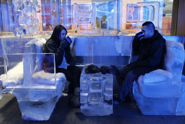 A British couple drink hot chocolate at Chillout cafe in Dubai May 12, 2013. (Photo by Ahmed Jadallah/Reuters)