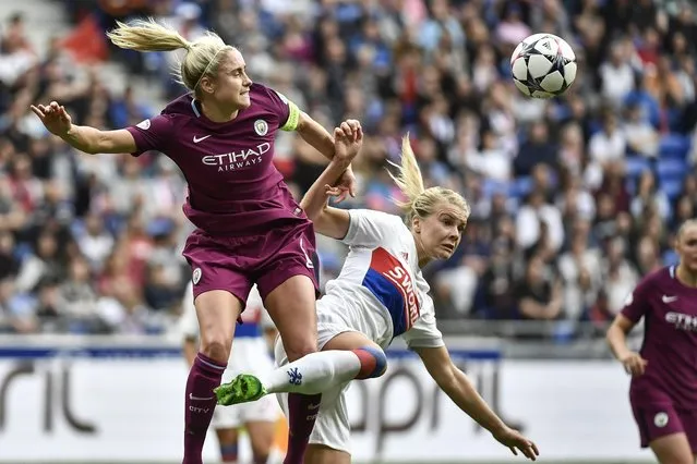 Lyon's Norwegian forward Ada Egerberg (R) vies with Manchester City's English defender Steph Houghton during the French C1 women semifinal football match Olympique Lyonnais (OL) vs Manchester City on April 29, 2018, at the Parc Olympique Lyonnais stadium in Decines-Charpieu, central-eastern France. (Photo by Jeff Pachoud/AFP Photo)