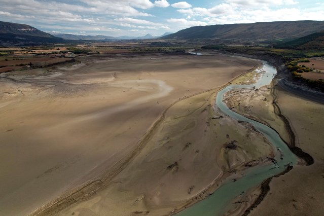 A drone image shows the Yesa Reservoir after its water level dropped, revealing part of its bed, in the village of Yesa, Navarra, northern Spain, 12 November 2025. (Photo by Jesús Diges/EPA)