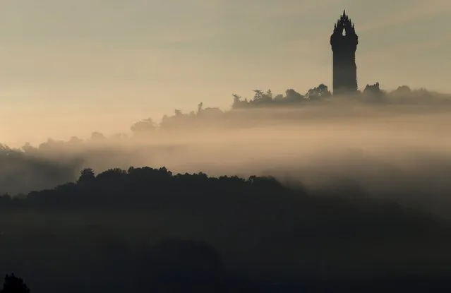 The Wallace Monument sits above the morning mist in Stirling, Scotland September 30, 2015. (Photo by Russell Cheyne/Reuters)
