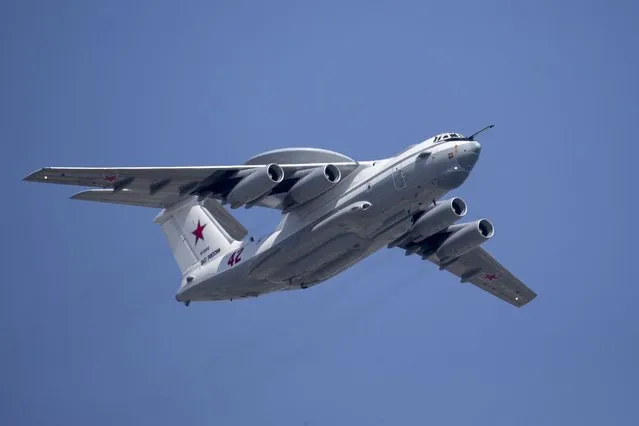 In this file photo taken on Tuesday, May 7, 2019, A Russian Beriev A-50 airborne early warning and control training aircraft flies over Red Square during a rehearsal for the Victory Day military parade in Moscow, Russia. After Russia invaded Ukraine, guerrillas from Belarus began carrying out acts of sabotage on their country's railways, including blowing up track equipment to paralyse the rails that Russian forces used to get troops and weapons into Ukraine. (Photo by Alexander Zemlianichenko/AP Photo)