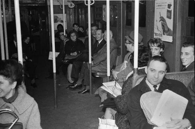 Passengers sit patiently in near-darkness in a stalled subway car at West 4th Street in the Manhattan section of New York, November 9, 1965, during the massive power failure that darkened a vast portion of the northeast including New York State, most of New England, parts of New Jersey and Pennsylvania, and Ontario, Canada. (Photo by Jerry Mosey/AP Photo)