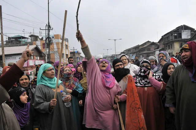 Kashmiri women shout slogans during a protest against Consumer Affairs and Public Distribution (CA&PD) department at Maisuma area on December 14, 2015 in Srinagar, India.  They were asking for extension of date for enrolment for new ration cards under National Food Security Act to February 1. According to the schedule of the CAPD department, the enrolment for new ration cards under NFSA will be held from December 7 to December 18 this month. (Photo by Waseem Andrabi/Hindustan Times via Getty Images)