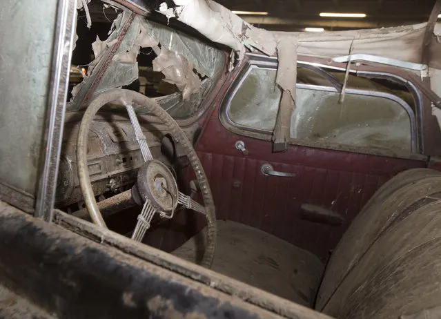 Packard Eight Cabriolet is displayed during a preview for an auction of vintage cars Retromobile show in Paris, Tuesday, February 3, 2015, after a treasure trove of classic cars was discovered after spending 50-years languishing in storage on a farm. (Photo by Jacques Brinon/AP Photo)