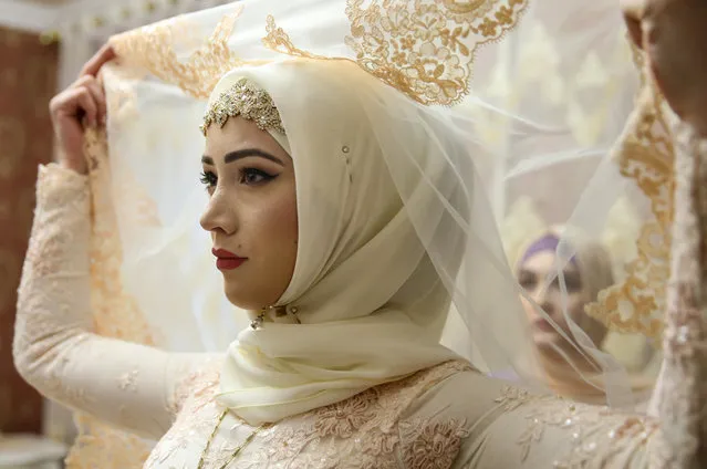 The bride in her room, prepared for a traditional Chechen wedding ceremony in Grozny, Chechnya, Russia on November 24, 2016. (Photo by Valery Sharifulin/TASS)